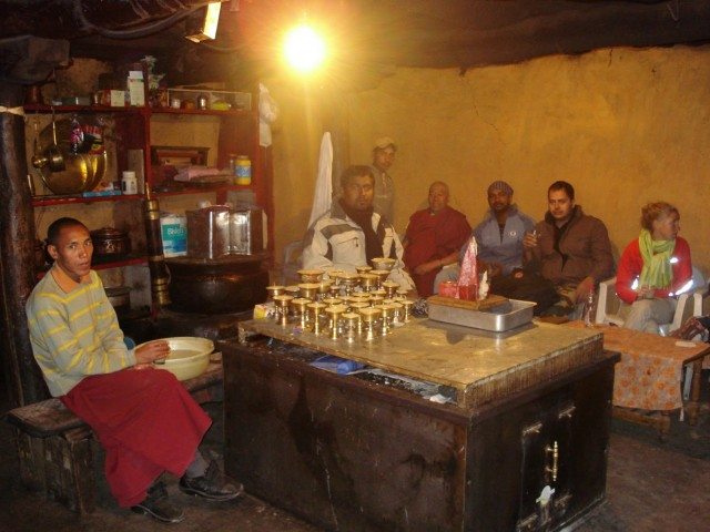 Having butter tea inside the Kye Monastery Kitchen