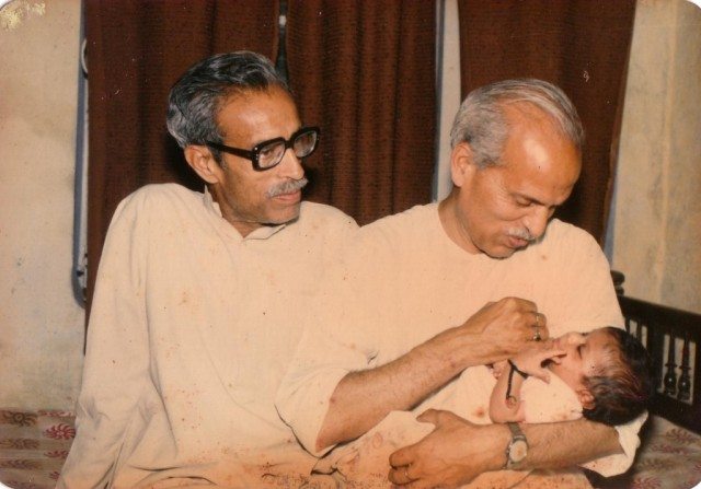 My father and Chachaji with Akshat in Chachaji's hands
