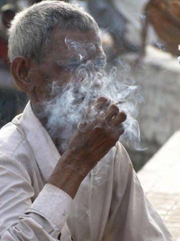 Stolen picture... an old villager busy with his smoking !