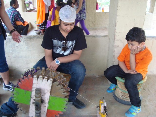This charkha is made up of Sandal wood or not, I do not know, but Ravi is operating it with the same preet!!!