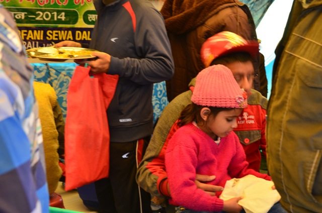 A girl inside a Bhandara near the cave, Age! 7-8 years