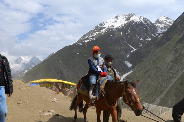 The boy of 7-8 years returning from the Holy cave