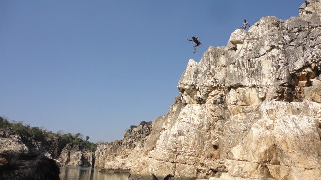 Boys jumping in order to make money