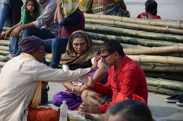 A priest performing puja on Sagar beach